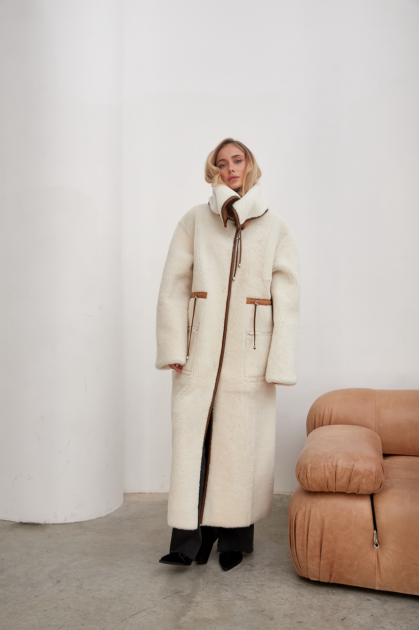 A long white sheepskin coat