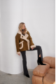 A stylish olive-colored sheepskin coat made of natural sheepskin