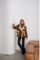 A stylish olive-colored sheepskin coat made of natural sheepskin