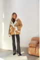 Stylish sand-colored sheepskin coat made of natural sheepskin