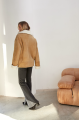 Stylish sand-colored sheepskin coat made of natural sheepskin