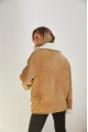 Stylish sand-colored sheepskin coat made of natural sheepskin