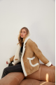 Stylish sand-colored sheepskin coat made of natural sheepskin