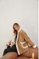 Stylish sand-colored sheepskin coat made of natural sheepskin