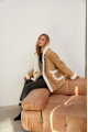 Stylish sand-colored sheepskin coat made of natural sheepskin