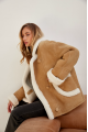 Stylish sand-colored sheepskin coat made of natural sheepskin