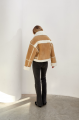 Stylish short sand-colored sheepskin coat made of natural sheepskin