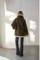 Stylish brown sheepskin coat made of natural sheepskin in VINTAGE style