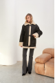 Stylish vintage sheepskin coat of black color made of natural sheepskin in VINTAGE style