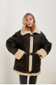 Stylish vintage sheepskin coat of black color made of natural sheepskin in VINTAGE style