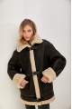 Stylish vintage sheepskin coat of black color made of natural sheepskin in VINTAGE style