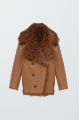 Double-sided curly brown sheepskin coat made of natural sheepskin in OVERSIZE style