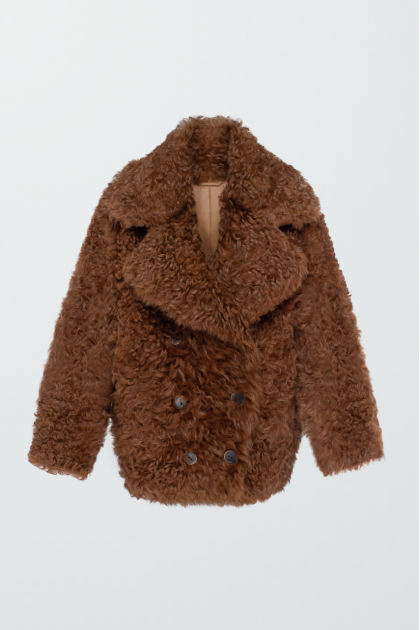 Double-sided curly brown sheepskin coat made of natural sheepskin in OVERSIZE style