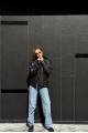 Women's black leather jacket with fur collar