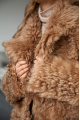 Long double-sided sheepskin coat made of natural sheepskin in brown color