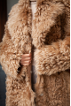 Long double-sided sheepskin coat made of natural sheepskin in brown color