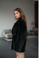 Women's two-sided sheepskin jacket made of natural black colored sheepskin