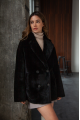 Women's two-sided sheepskin jacket made of natural black colored sheepskin