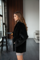 Women's two-sided sheepskin jacket made of natural black colored sheepskin