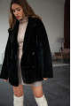 Women's two-sided sheepskin jacket made of natural black colored sheepskin