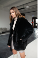 Women's two-sided sheepskin jacket made of natural black colored sheepskin