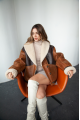 Women's sheepskin coat in VINTAGE style and a stylish combination of dark chocolate and whiskey colors