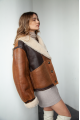 Women's sheepskin coat in VINTAGE style and a stylish combination of dark chocolate and whiskey colors