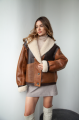 Women's sheepskin coat in VINTAGE style and a stylish combination of dark chocolate and whiskey colors