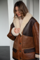 Long women's sheepskin coat in VINTAGE style and a stylish combination of dark chocolate and whiskey colors