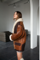 Long women's sheepskin coat in VINTAGE style and a stylish combination of dark chocolate and whiskey colors