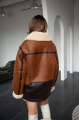 Long women's sheepskin coat in VINTAGE style and a stylish combination of dark chocolate and whiskey colors