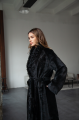 Long sheepskin coat made of natural sheepskin in black color