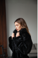 Long sheepskin coat made of natural sheepskin in black color