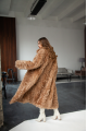 Long two-sided sheepskin coat made of natural sheepskin in camel color