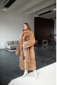 Long two-sided sheepskin coat made of natural sheepskin in camel color