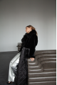 Long black sheepskin coat made of natural sheepskin with a down jacket