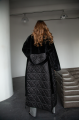 Long black sheepskin coat made of natural sheepskin with a down jacket