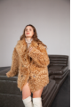 Women's two-sided sheepskin jacket made of natural caramel colored sheepskin