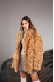 Women's two-sided sheepskin jacket made of natural caramel colored sheepskin