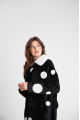 Long sheepskin coat made of black natural sheepskin with a pea print