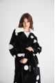 Long sheepskin coat made of black natural sheepskin with a pea print