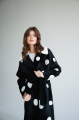 Long sheepskin coat made of black natural sheepskin with a pea print