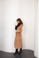 A long brown sheepskin coat with sable fur