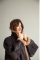 Women's long sheepskin coat of dark chocolate color made of natural sheepskin in VINTAGE style