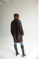 Women's long sheepskin coat of dark chocolate color made of natural sheepskin in VINTAGE style