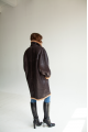 Women's long sheepskin coat of dark chocolate color made of natural sheepskin in VINTAGE style