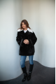 Women's black sheepskin coat made of natural sheepskin with a white mink collar