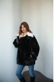 Women's black sheepskin coat made of natural sheepskin with a white mink collar