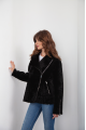 A classic sheepskin coat of black color made of natural sheepskin