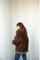 Chocolate-colored women's sheepskin coat made of natural sheepskin in VINTAGE style